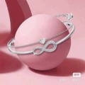 Figure-eight bangle in white gold