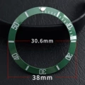 Ceramic green circle silver lettering blue green light