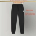 Trousers black with white label