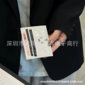 Seven card white crocodile pattern cross