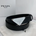 P-shaped silver buckle with black dots on white background