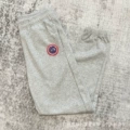 Gray pants with red label