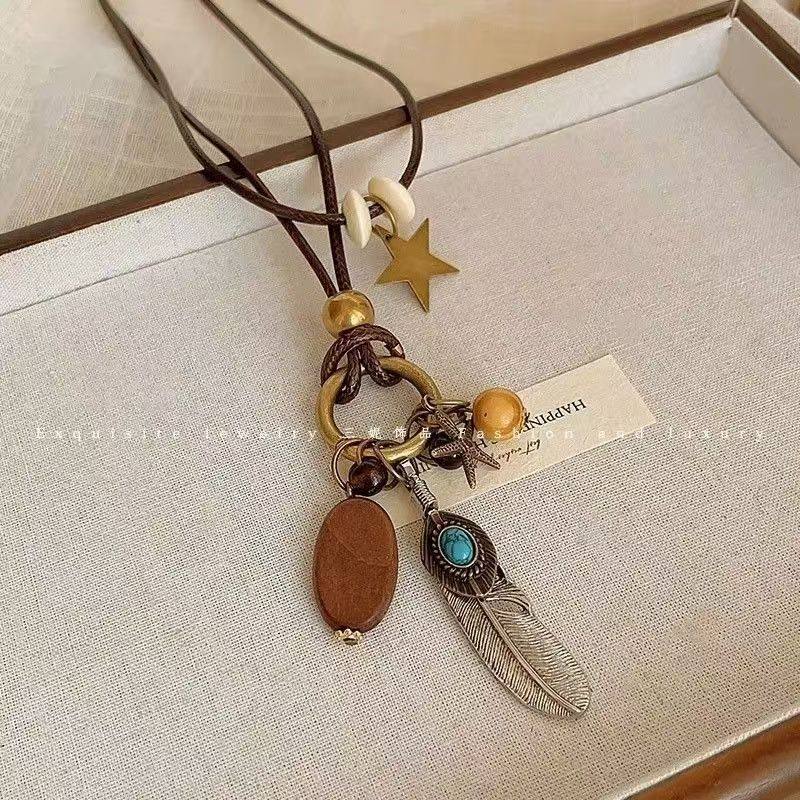 New Chinese Style Retro Long Sweater Chain Zen Feather Necklace Women's 2024 New Ethnic Style Stacking Accessories Autumn