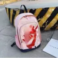 Red logo on pink blue background
