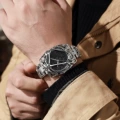 Silver and black spider web cross