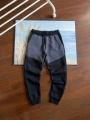 Black and dark gray trousers