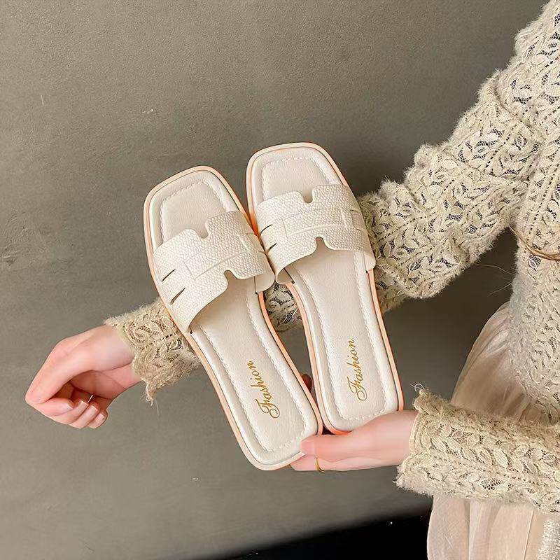 Korean version of slippers women's one-word new flat-bottomed net red out summer wear small fragrant style high-end beach slippers wholesale