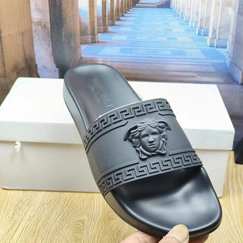 Vietnam Cambodia 2024 spring men's and women's new beach sandals metal beauty head flat embossed women's slippers