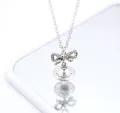 Transparent orb bow necklace