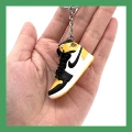 1 black and yellow toe (single key ring)