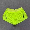 Fluorescent green three-quarter pants (black hooks on both sides)