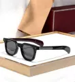Black and silver frame, red inner leg, gray lens