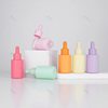 In stock macaron essential oil bottle 30ml color flat shoulder essence bottle cosmetics sub-packaging small sample bottle dropper small bottle