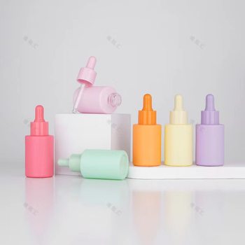 In stock macaron essential oil bottle 30ml color flat shoulder essence bottle cosmetics sub-packaging small sample bottle dropper small bottle