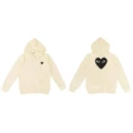 Off-white pullover with a large black heart zipper on the back