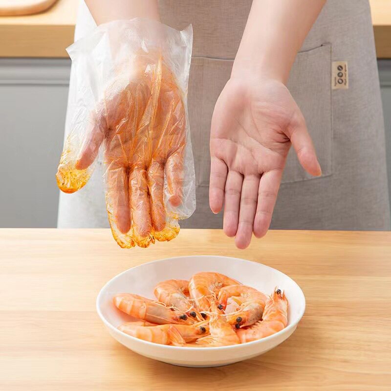 Xinyihe disposable gloves food catering household pe gloves kitchen plastic transparent waterproof film gloves