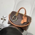 Monogrammed ostrich leather travel bag