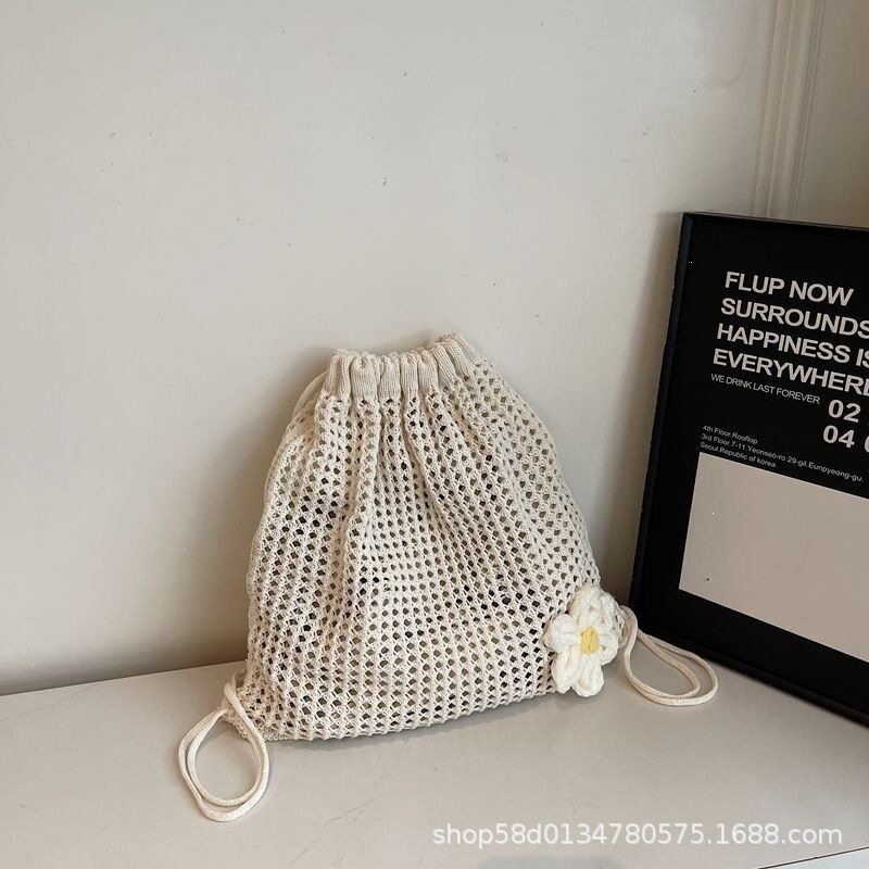 简约休闲针织双肩包女2025新款时尚抽绳编织后背包春夏百搭沙滩包