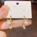 No. 73 zircon bow pearl ear buckle (real gold plating)