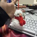 Scarf-wearing curly-frilled snowman ornament