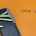 Black embossed + gold buckle