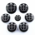 All black 7-piece set front and rear + 4 56mm hub caps + steering wheel logo