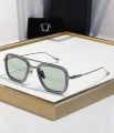 Silver-gray frame, green lens