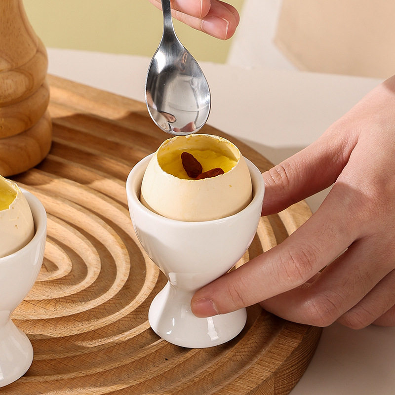 Simple ceramic egg cup egg cup egg cup egg cup high leg egg tray simple dining table Cup bracket creative candle Cup decoration