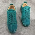 Green low-top spikes