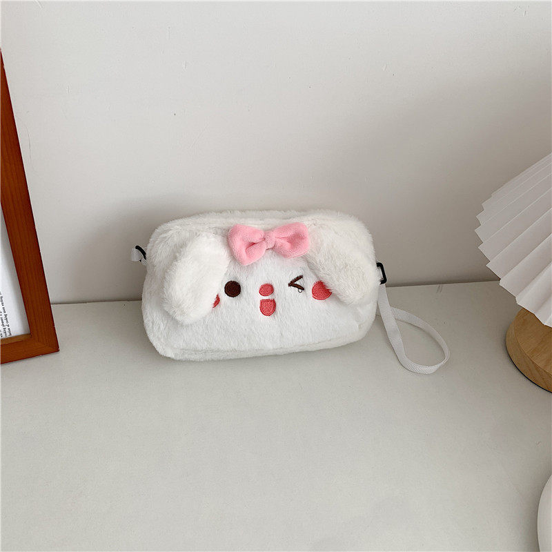 携帯バッグまばたき子犬