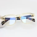 Translucent yellow frame tortoise shell legs