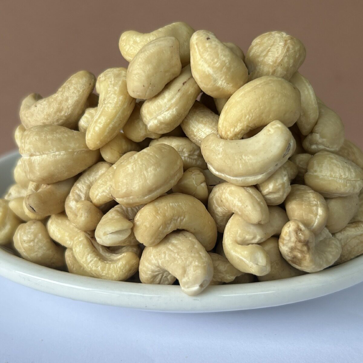 According to KG Vietnam cashew nuts crushed half kernel nuts wholesale plain imported bulk raw material baking special salt baked half
