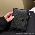 Black gold saturn lychee pattern zipper bag