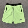 Triangle logo green shorts