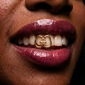 Two-toothed openwork cross, gold finish