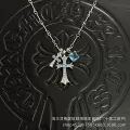 Silver sugar cube-light blue diamond double cross necklace