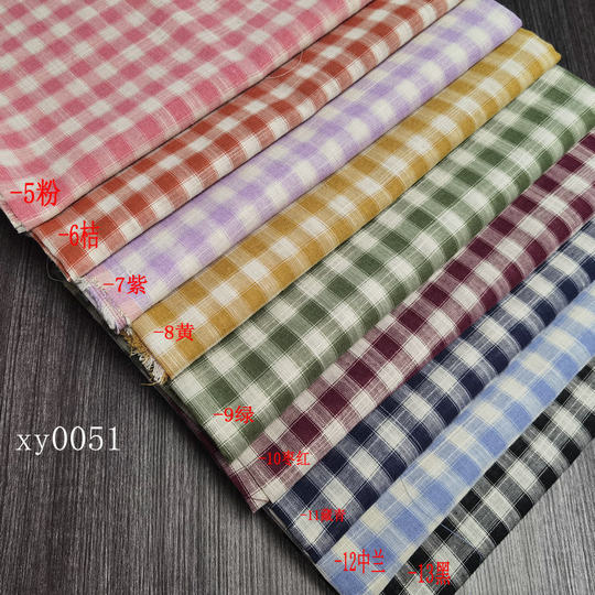 Spring and summer plaid shirt fabric 21 polyester cotton yarn-dyed fabric 135 square grams woven jacquard fabric spot