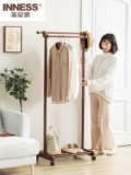 Сплошной древесиной двойной пелот для стойки на пол -к гостиной -комнатной комнате, подвесная вешалка Простые и современные домашние стойки для одежды могут двигаться