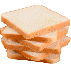 Fresh large slices of toast bread sliced ​​barbecue sandwich bread slices are cut using a hotel commercial stall bread machine
