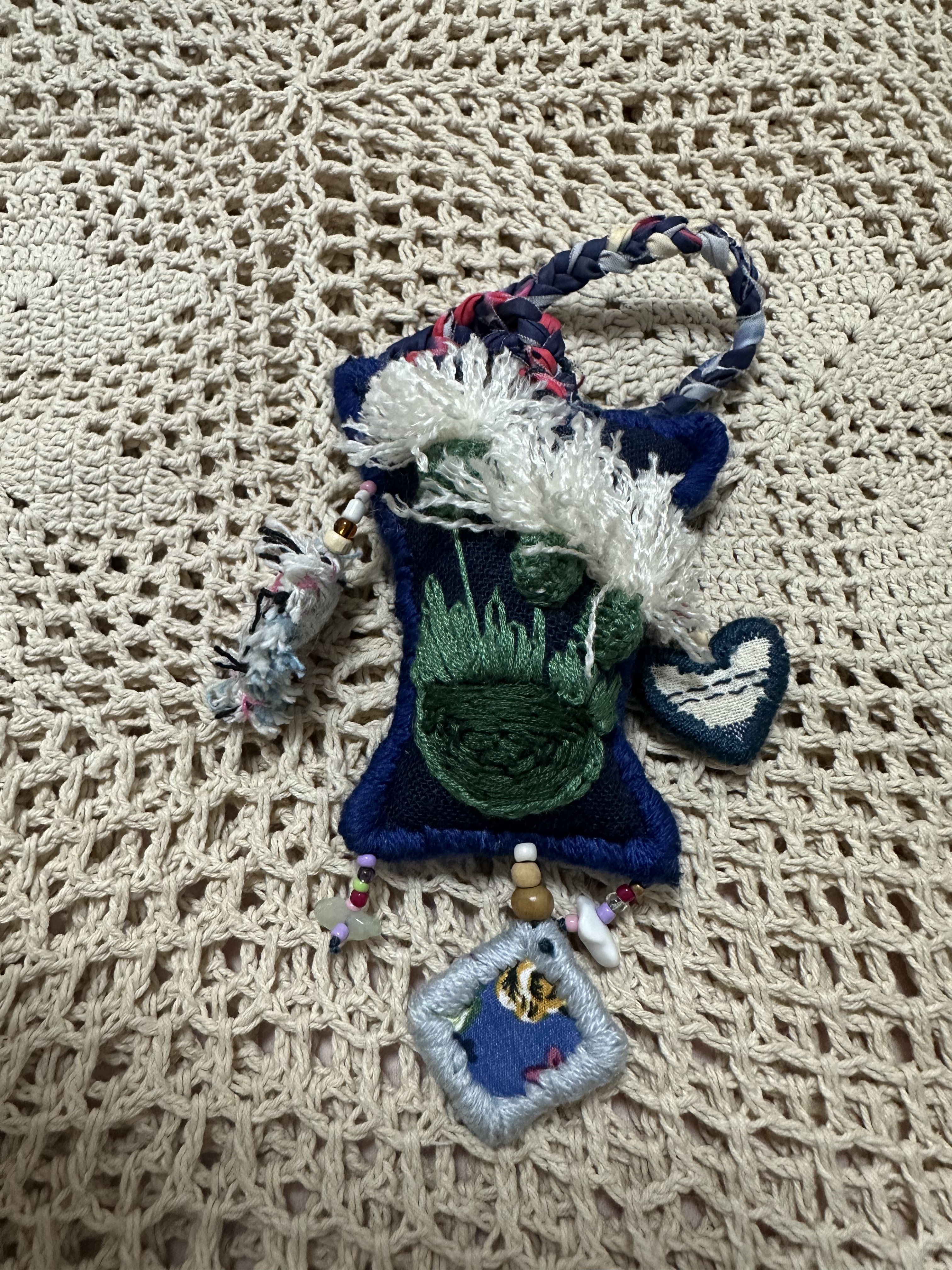 Every detail is filled with love for life. Handmade cotton and linen embroidered beaded bags by artisans in Chiang Mai, Thailand.
