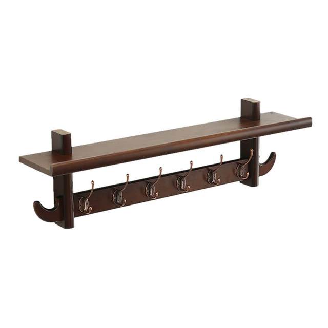 Multifunctional creative clothes rack behind the living room door on the wall