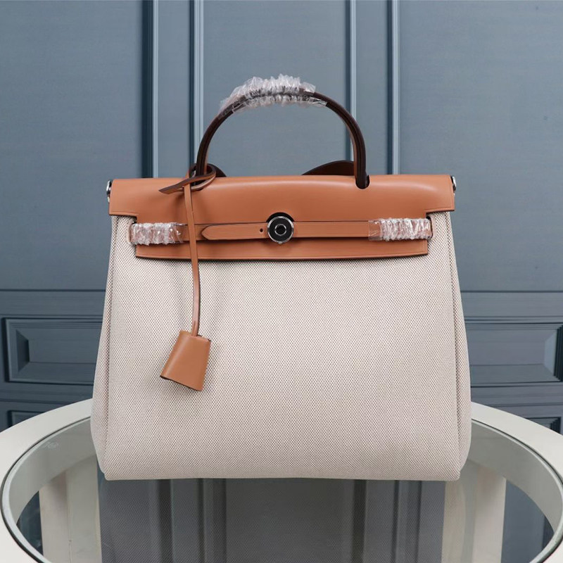 Herbag bag, made of imported top-grain cowhide and canvas, is a large-capacity handbag suitable for women, worn as a shoulder or crossbody bag. It's perfect for commuting.