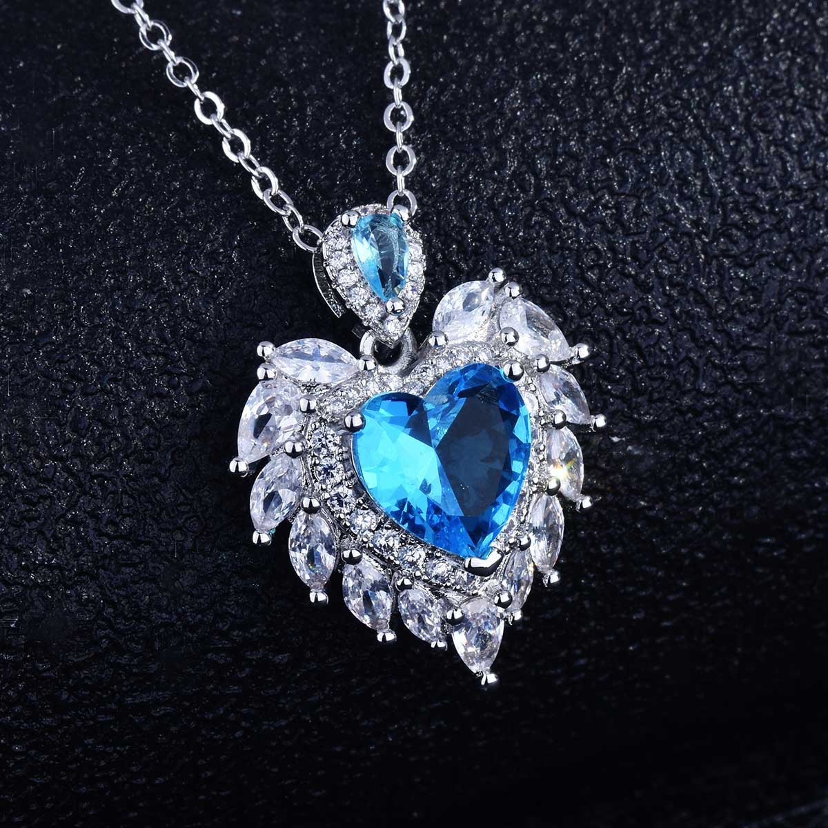 YG Fashion High-End Jewelry Design: Angel Wings Heart Pendant with Simulated Aquamarine Wings, Heart-Shaped Necklace for Women