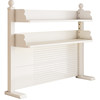 Multi-layer perforated board bookshelf on home computer desk