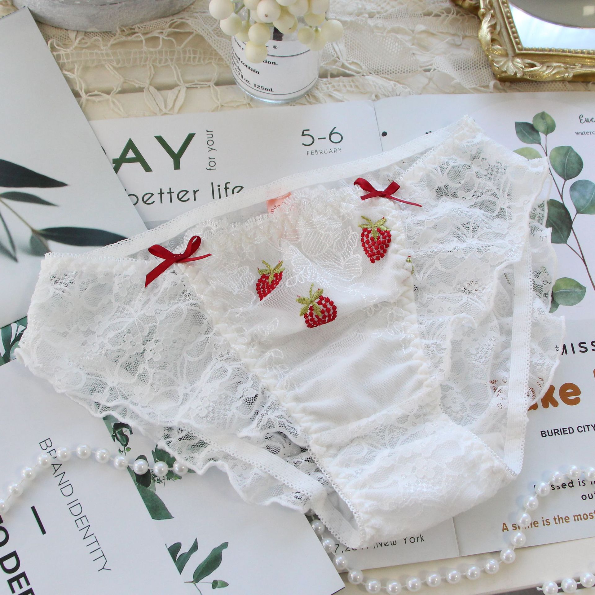 Japanese-style pure and sexy embroidered strawberry anime-inspired plus-size lace-up briefs for women.