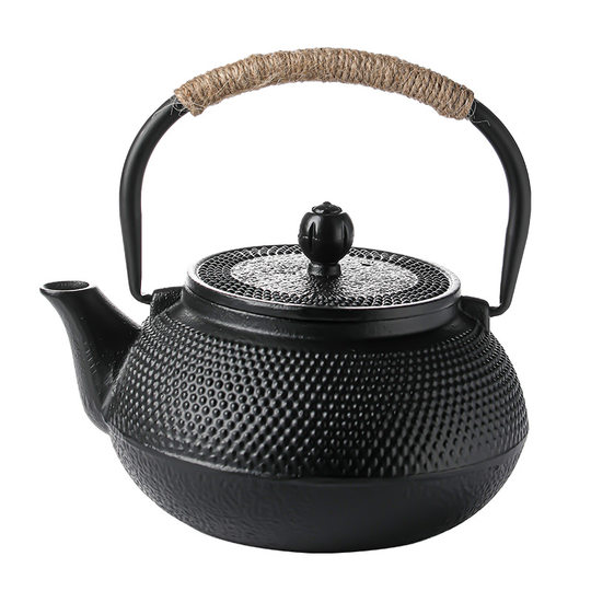 Cast iron teapot set tea set around the stove to make tea and kettle