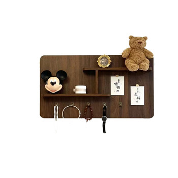 Shelves are renovated to cover the distribution box and hang paintings in a simple way