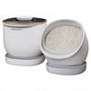The rice bucket in the cupboard faces forward to scoop rice without fear of hitting the top.