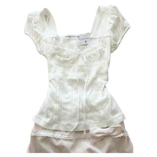 Lace-trimmed women's sheer lust-style top underneath a base layer shirt