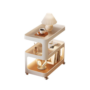 Mobile small coffee table with wheels on the bedside table and cabinets